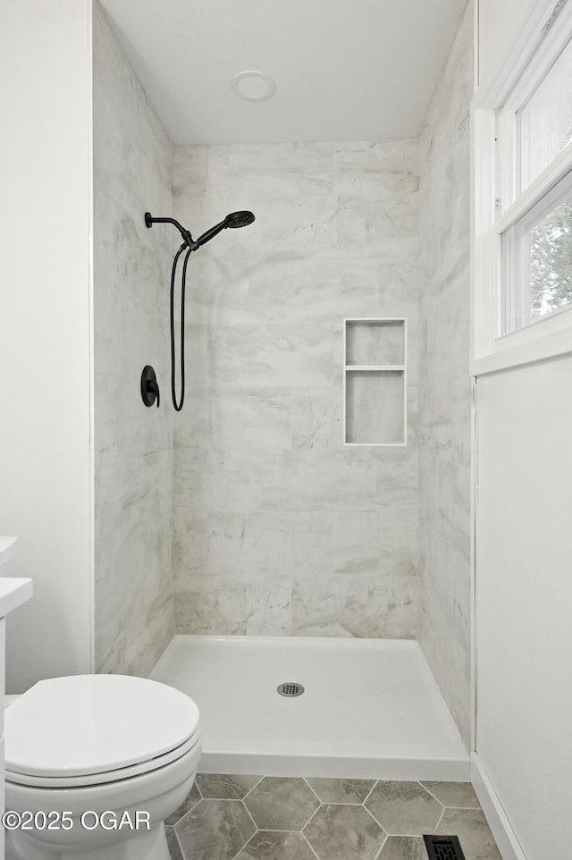 12807 Larissa Ln, Neosho, MO 64850 - bathroom with tiled shower and toilet