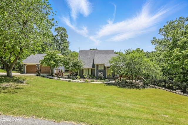 3310 Tana St, Joplin, MO 64804 - view of front of home featuring a garage, a shingled roof, and driveway