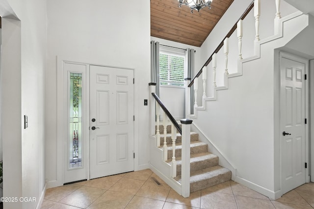 3310 Tana St, Joplin, MO 64804 - foyer featuring wood ceiling, stairs, light tile patterned floors, and high vaulted ceiling