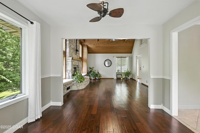 3310 Tana St, Joplin, MO 64804 - foyer featuring hardwood / wood-style flooring, a ceiling fan, a stone fireplace, vaulted ceiling, and wood ceiling