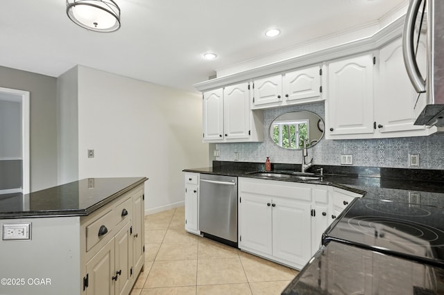 3310 Tana St, Joplin, MO 64804 - kitchen featuring appliances with stainless steel finishes, tasteful backsplash, white cabinets, light tile patterned flooring, and recessed lighting