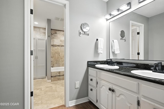 3310 Tana St, Joplin, MO 64804 - full bathroom with double vanity and tiled shower / bath combo