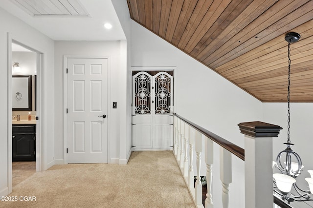 3310 Tana St, Joplin, MO 64804 - corridor featuring light colored carpet, vaulted ceiling, wood ceiling, and recessed lighting