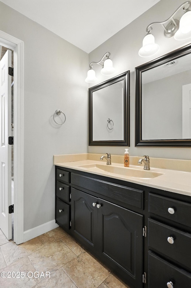 3310 Tana St, Joplin, MO 64804 - bathroom with double vanity and baseboards