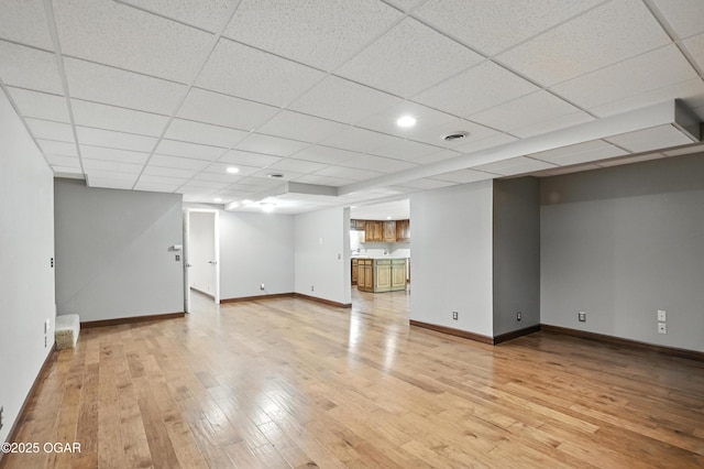 3310 Tana St, Joplin, MO 64804 - finished basement featuring light wood finished floors and a drop ceiling
