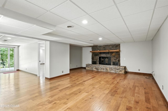 3310 Tana St, Joplin, MO 64804 - unfurnished living room with wood finished floors and a fireplace