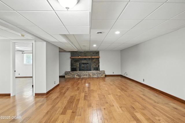 3310 Tana St, Joplin, MO 64804 - unfurnished living room with light wood finished floors, a stone fireplace, and recessed lighting