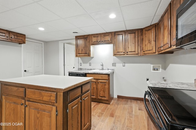 3310 Tana St, Joplin, MO 64804 - washroom featuring hookup for an electric dryer, light wood-style flooring, washer hookup, and recessed lighting