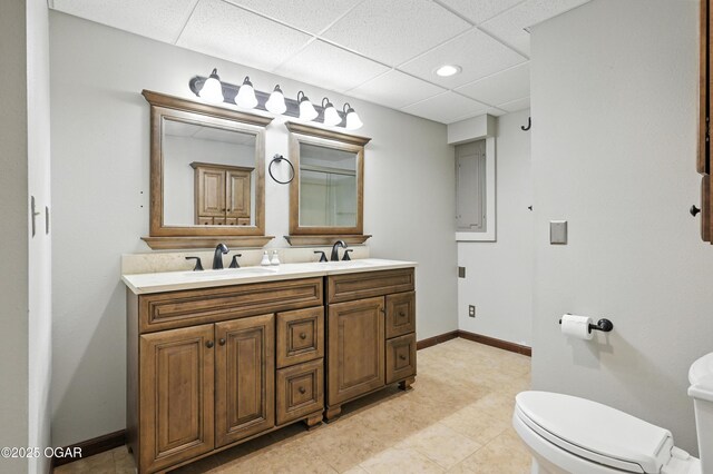 3310 Tana St, Joplin, MO 64804 - full bathroom with double vanity, a paneled ceiling, and recessed lighting
