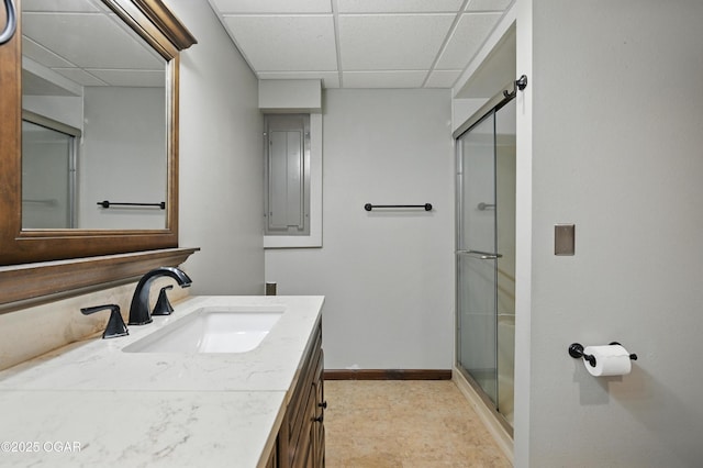 3310 Tana St, Joplin, MO 64804 - full bathroom featuring a paneled ceiling, vanity, a stall shower, and electric panel