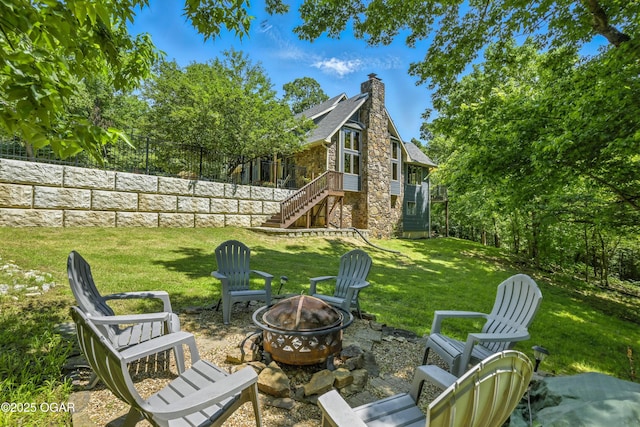 3310 Tana St, Joplin, MO 64804 - view of green lawn with a fire pit and stairs