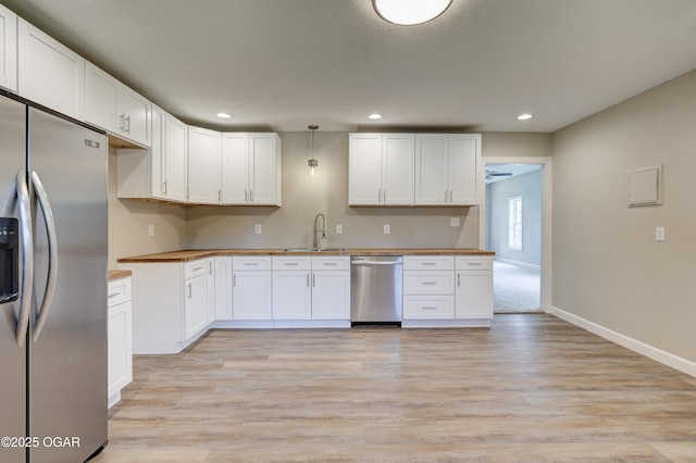 1908 S Picher, Joplin, MO 64804 - kitchen with appliances with stainless steel finishes, light wood-type flooring, recessed lighting, white cabinets, and butcher block countertops
