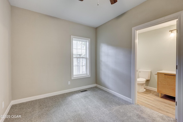 1908 S Picher, Joplin, MO 64804 - unfurnished bedroom with carpet floors, ensuite bath, and a ceiling fan