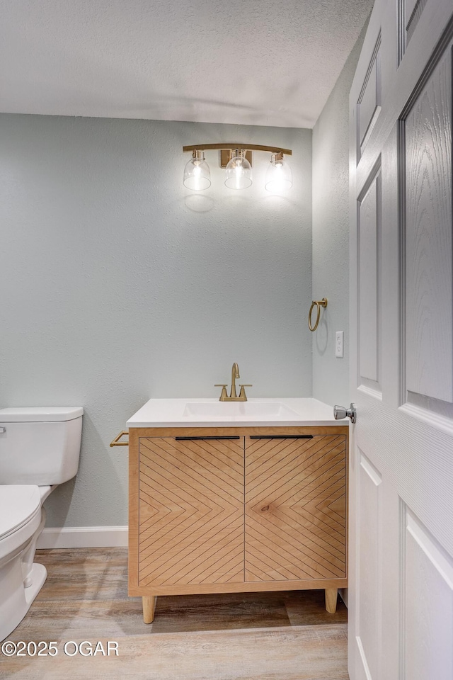 1908 S Picher, Joplin, MO 64804 - half bathroom featuring vanity and wood finished floors