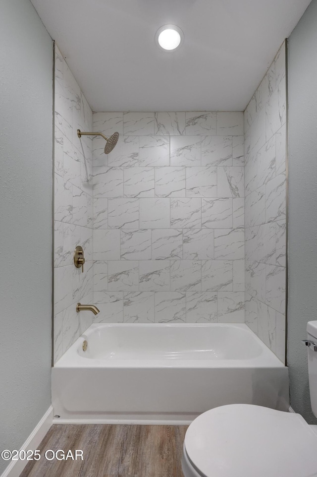 1908 S Picher, Joplin, MO 64804 - bathroom featuring bathtub / shower combination and wood finished floors