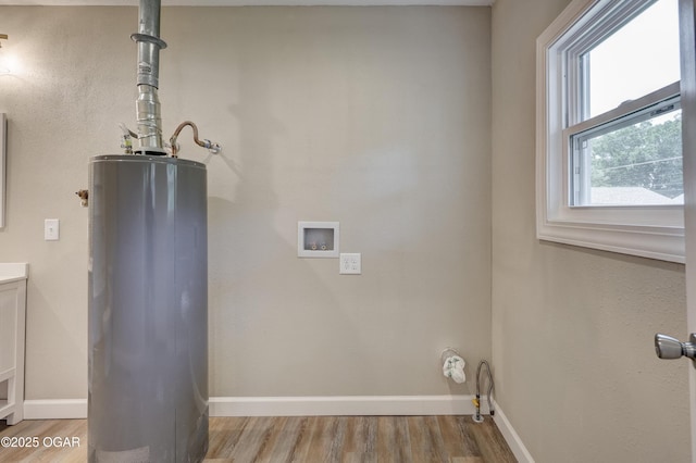 1908 S Picher, Joplin, MO 64804 - laundry area with water heater, light wood-type flooring, and hookup for a washing machine
