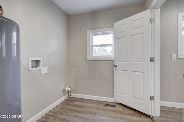 1908 S Picher, Joplin, MO 64804 - washroom with hookup for a washing machine and wood finished floors
