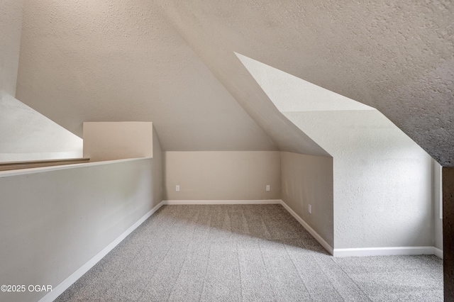 1908 S Picher, Joplin, MO 64804 - additional living space featuring a textured ceiling, vaulted ceiling, and carpet flooring