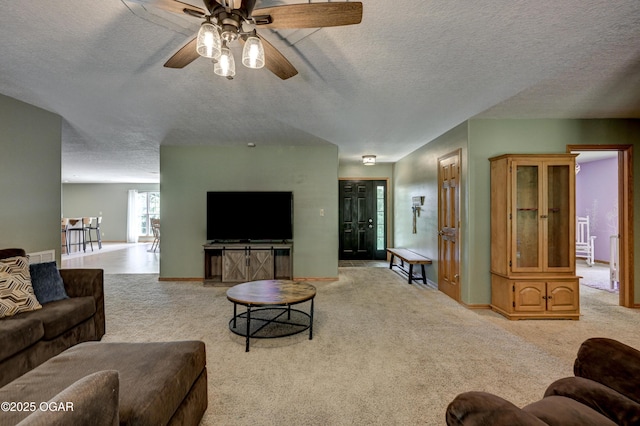121 Fawn Trl, Seneca, MO 64865 - carpeted living area featuring a ceiling fan and a textured ceiling