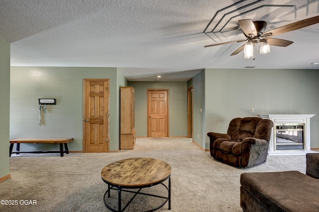 121 Fawn Trl, Seneca, MO 64865 - carpeted living area with ceiling fan and a textured ceiling