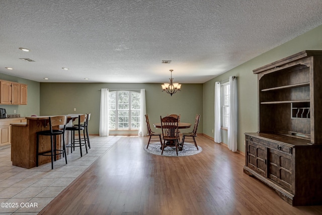 121 Fawn Trl, Seneca, MO 64865 - dining space with a textured ceiling, light wood-type flooring, a chandelier, and recessed lighting