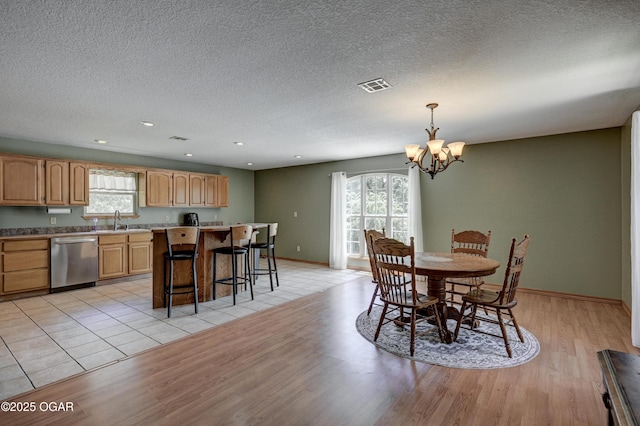 121 Fawn Trl, Seneca, MO 64865 - dining space with light wood finished floors, a chandelier, a textured ceiling, and recessed lighting