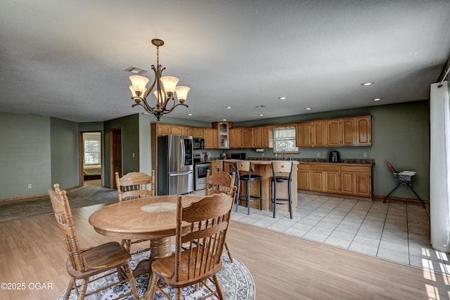 121 Fawn Trl, Seneca, MO 64865 - dining area featuring a chandelier, light wood-style floors, and recessed lighting