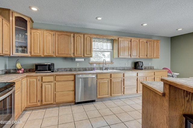 121 Fawn Trl, Seneca, MO 64865 - kitchen featuring stainless steel appliances, glass insert cabinets, light countertops, a textured ceiling, and recessed lighting