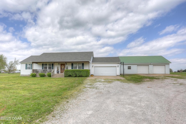 23841 Jaguar Rd, Oronogo, MO 64855 - ranch-style house featuring driveway, a porch, a front yard, and a garage