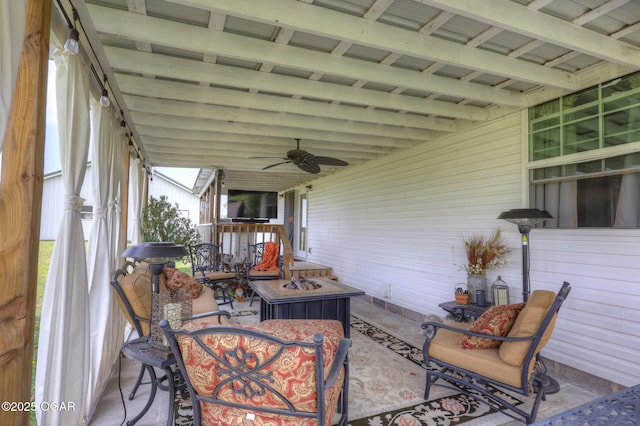 23841 Jaguar Rd, Oronogo, MO 64855 - sunroom / solarium featuring a ceiling fan and a fire pit