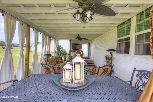 23841 Jaguar Rd, Oronogo, MO 64855 - sunroom / solarium with ceiling fan, plenty of natural light, and beamed ceiling