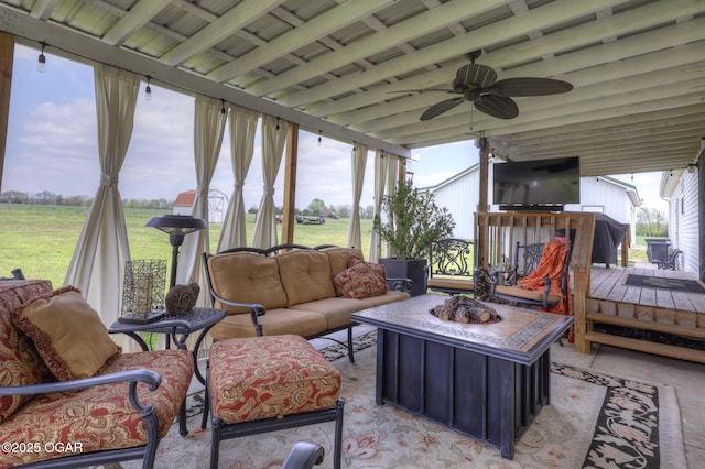 23841 Jaguar Rd, Oronogo, MO 64855 - sunroom / solarium with a ceiling fan, an outdoor living space with a fire pit, and beamed ceiling