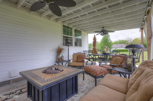 23841 Jaguar Rd, Oronogo, MO 64855 - view of patio with a ceiling fan, outdoor dining space, and an outdoor living space with a fire pit