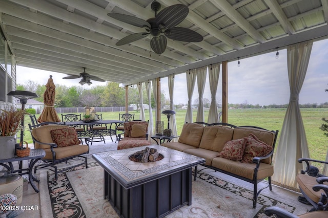 23841 Jaguar Rd, Oronogo, MO 64855 - sunroom featuring ceiling fan, outdoor dining space, an outdoor living space with a fire pit, and beam ceiling