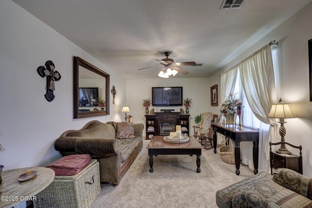 23841 Jaguar Rd, Oronogo, MO 64855 - living area with light colored carpet, a ceiling fan, and a textured ceiling