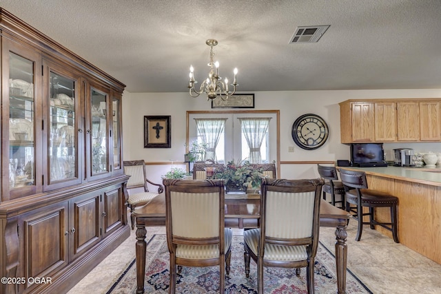 23841 Jaguar Rd, Oronogo, MO 64855 - dining area with a chandelier and a textured ceiling