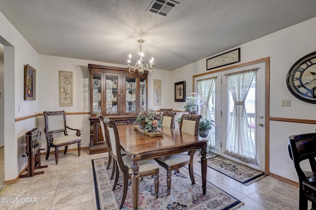 23841 Jaguar Rd, Oronogo, MO 64855 - dining room featuring a chandelier and a textured ceiling