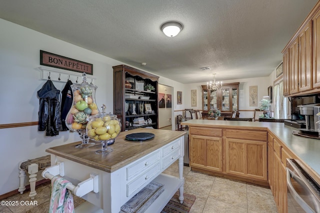 23841 Jaguar Rd, Oronogo, MO 64855 - kitchen with dishwasher, a peninsula, open shelves, a chandelier, and a textured ceiling