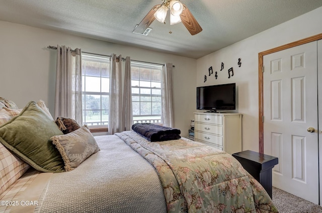 23841 Jaguar Rd, Oronogo, MO 64855 - carpeted bedroom with a textured ceiling and a ceiling fan