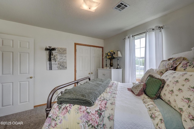 23841 Jaguar Rd, Oronogo, MO 64855 - bedroom with carpet, a closet, and a textured ceiling
