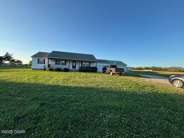 23841 Jaguar Rd, Oronogo, MO 64855 - single story home featuring a porch and a front lawn