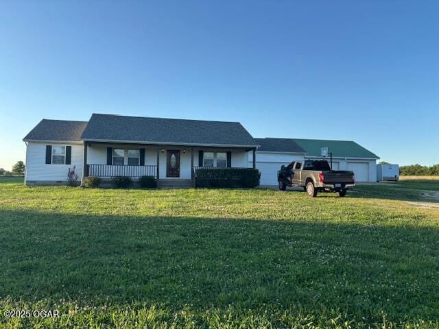 23841 Jaguar Rd, Oronogo, MO 64855 - ranch-style home with covered porch, a front lawn, and a garage