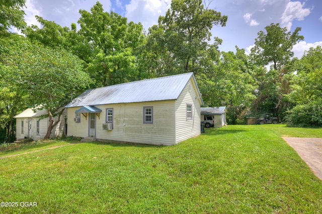 712 Joplin St, Sarcoxie, MO 64862 - view of front of property with a front yard, a metal roof, and cooling unit
