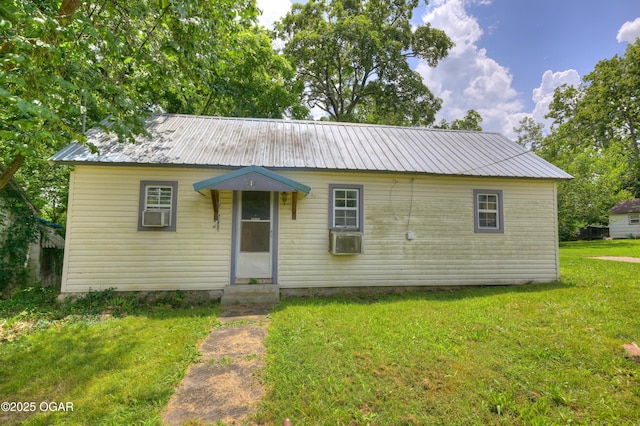 712 Joplin St, Sarcoxie, MO 64862 - view of front of home with a front yard, entry steps, a metal roof, and cooling unit