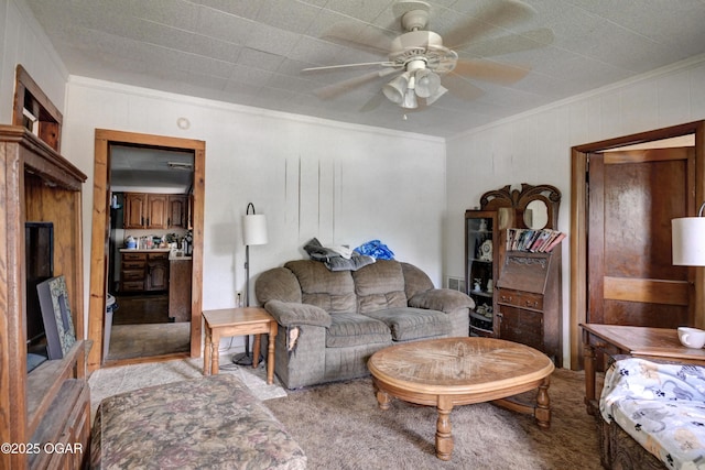 712 Joplin St, Sarcoxie, MO 64862 - living area featuring ornamental molding, a ceiling fan, and light carpet