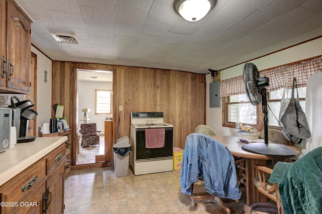 712 Joplin St, Sarcoxie, MO 64862 - dining area with electric panel and wood walls
