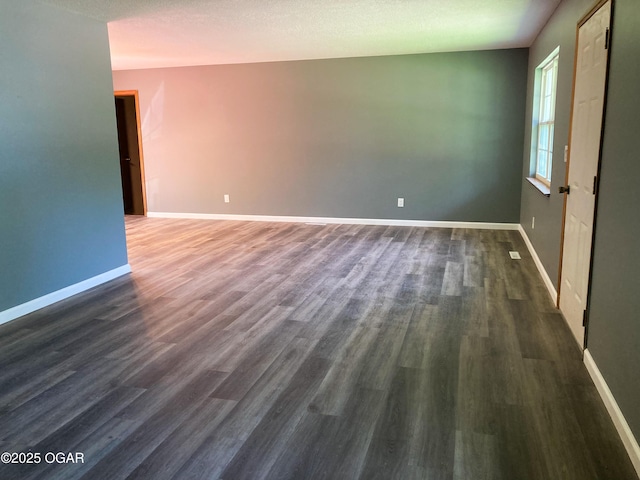 1212 W 12th St, Joplin, MO 64801 - unfurnished room with dark wood-type flooring and baseboards