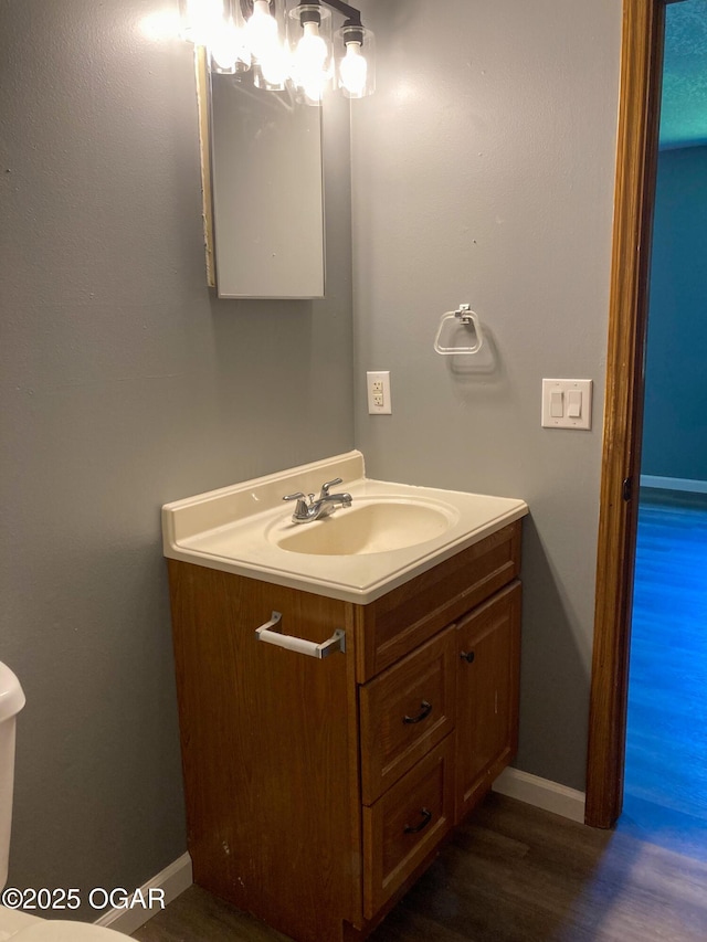 1212 W 12th St, Joplin, MO 64801 - half bath with vanity and wood finished floors