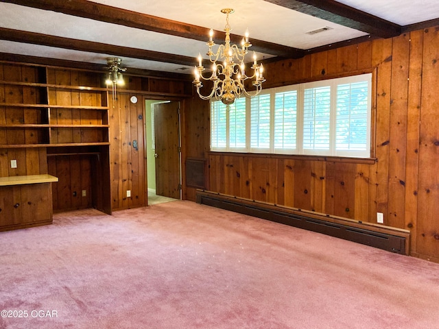 25399 Demott Dr, Joplin, MO 64801 - carpeted spare room featuring a baseboard radiator, wood walls, healthy amount of natural light, beam ceiling, and a chandelier