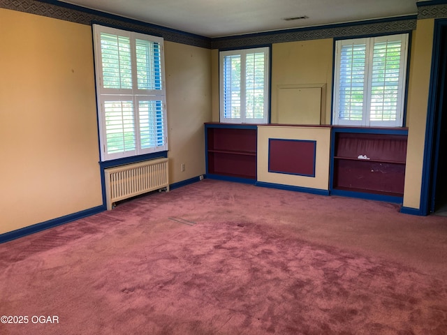 25399 Demott Dr, Joplin, MO 64801 - carpeted empty room featuring radiator and crown molding